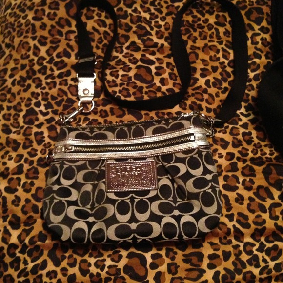 silver and black coach sling
