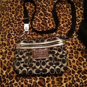 silver and black coach sling