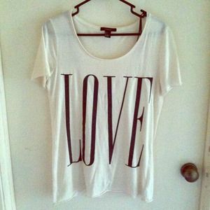 Cream top that says love❤