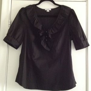Black short sleeved dress shirt.