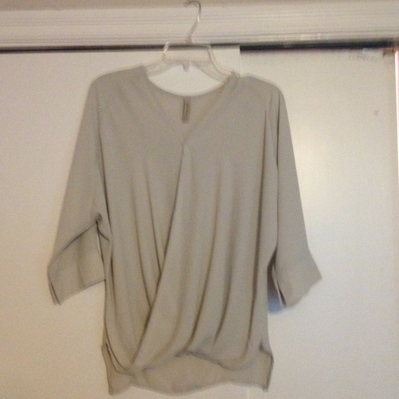 Cool high low top with wrap effect.