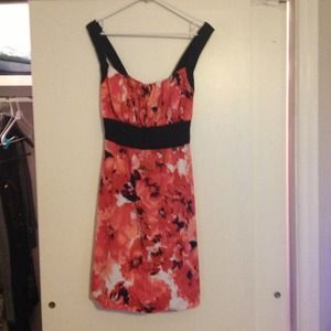 Cute dress with black tie in back.