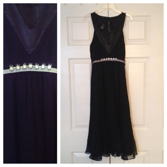 Black dress with jewel detailing.