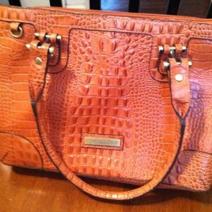 Etienne Aigner handbag.  Rust colored.