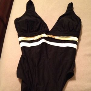 Black bathing suit with white and gold stripes