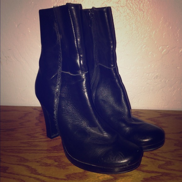 Black leather boots. Above the ankle.