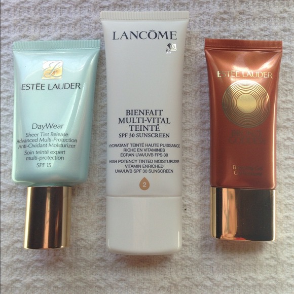 Estée Lauder and Lancôme and MK red cover.