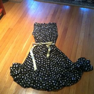 Sheer polka dot sleeveless dress.