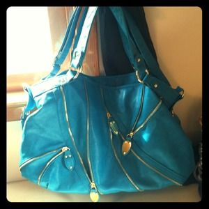 Teal handbag with gold hardware, barely used.