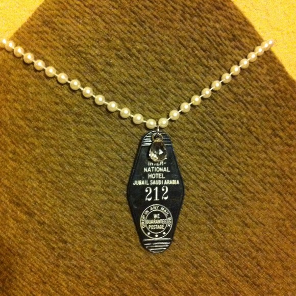 Old hotel key fob necklace