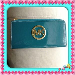 New turquoise patent leather-like MK logo in gold