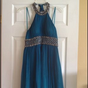 Blue dress, elegant, with lots of detail at neck