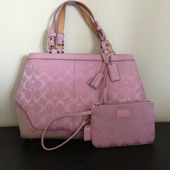 Reduced-Pink coach handbag with matching wristlet.