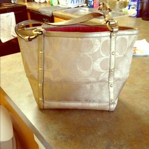 Gold coach purse
