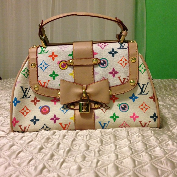 Louis Vuitton small hand bag with lock & key