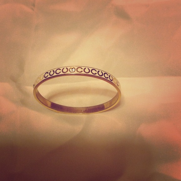 SOLD!!!!Coach Gold and Cream Bengal bracelet.