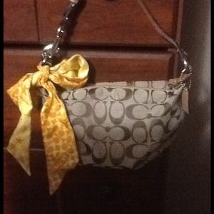 RESERVED.   2 Coach handbags and wallet bundle