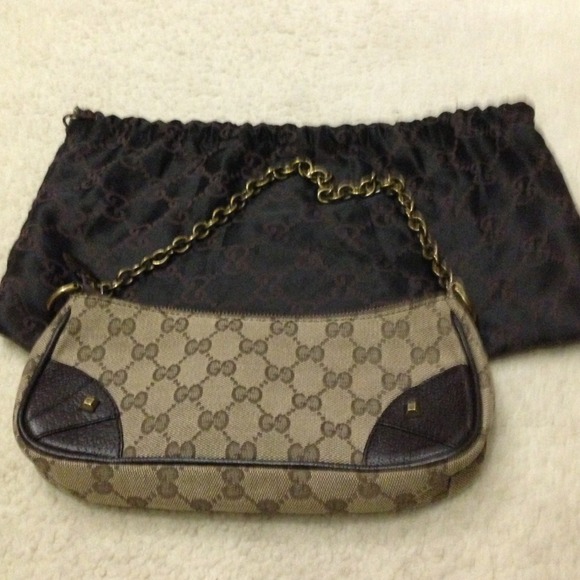 Authentic Gucci purse with chain link strap.