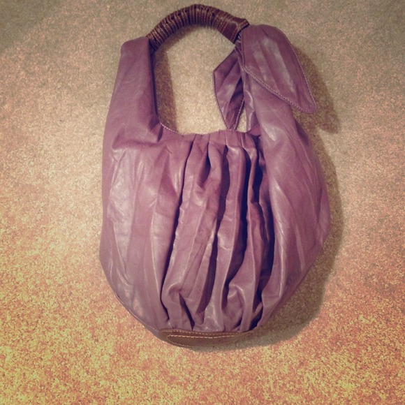 Large, purple, purse with bow on side