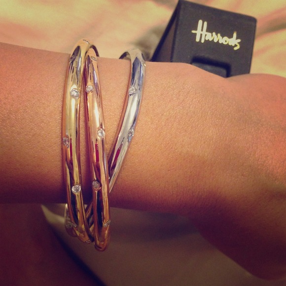 Gold silver and bronze interlaced bangles