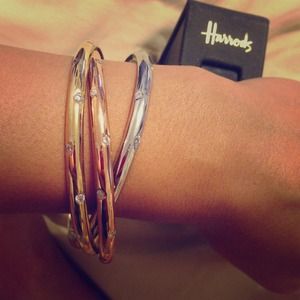 Gold silver and bronze interlaced bangles