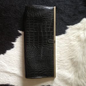 Chinese Laundry black snake skin print clutch.