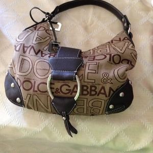 Dolce and gabana!! Never used