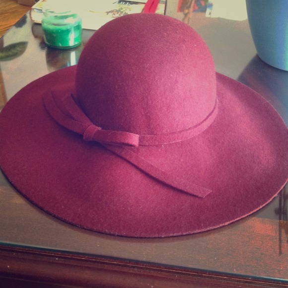 Sold! Maroon floppy hat and nail polish.