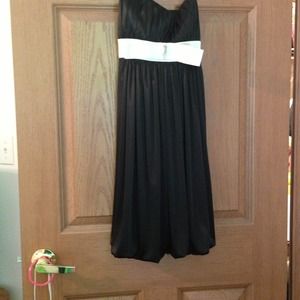 Black dress white bow tie around strap