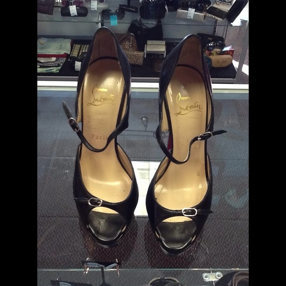 CHRISTIAN LOUBOUTINS BLACK PLATFORMS