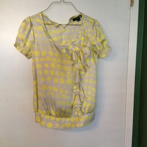Yellow polka dot shirt.