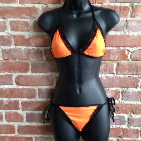Orange bikini. Trimmed in black lace.