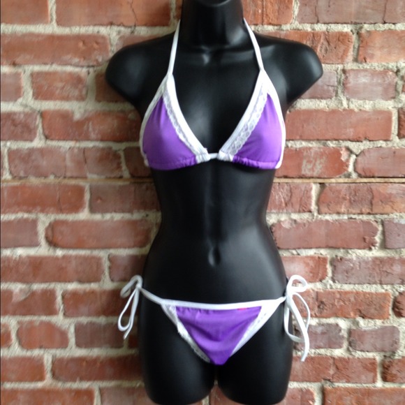 Purple bikini. Trimmed in white lace.
