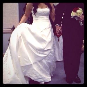 A Maggie sottero designer strapless wedding gown.