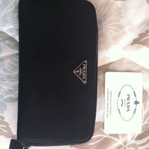 Large Prada zip around wallet with auth card.