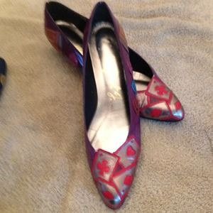 Red and purple flat with red cards on the toes.