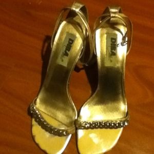 Gold strap around the ankle heels