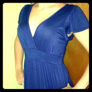 Knee-length navy blue V-neck dress with lace back.