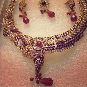 Gold carved necklace with Ruby red gemstone