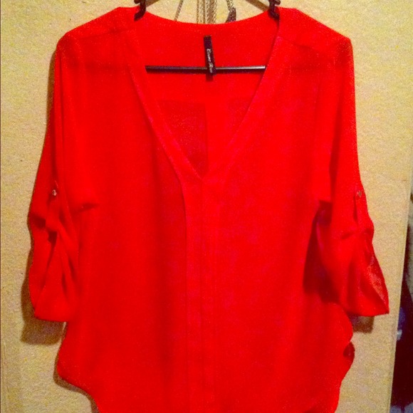 I'm selling this sheer red blouse