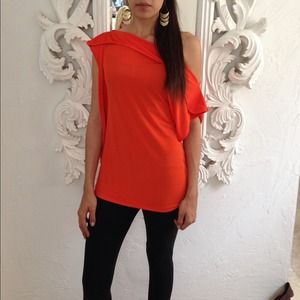 Cute on/ off shoulder melon colored top. NWOT