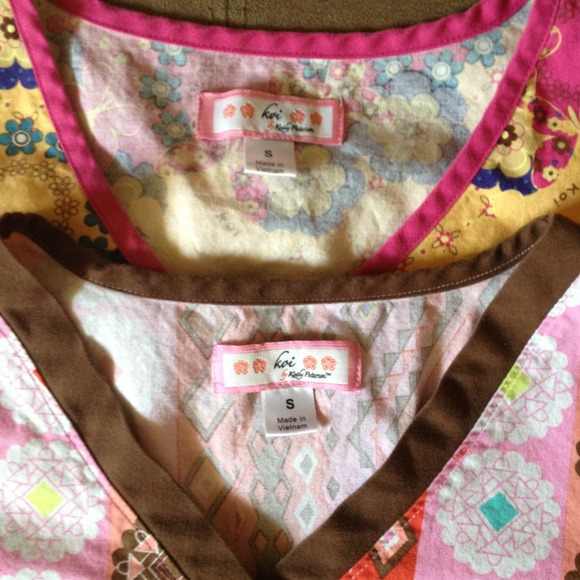 2 Koi Scrub Tops. A blue top. Pink scrub pants.