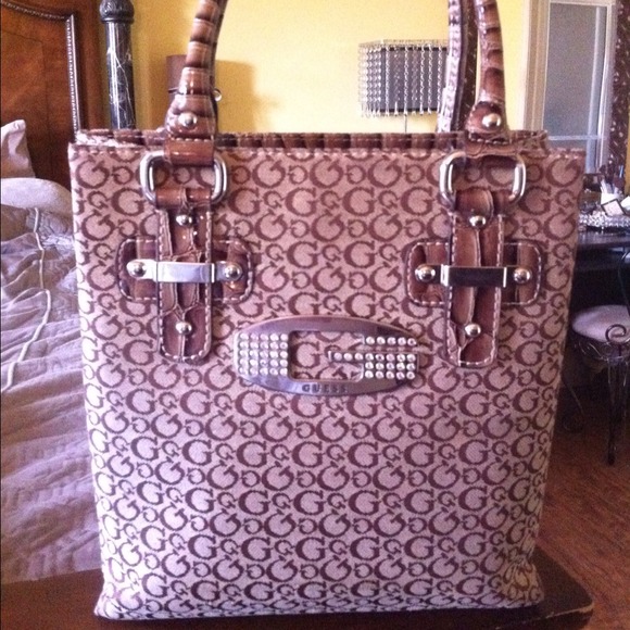 SOLD.... Guess purse with crystal covered G.