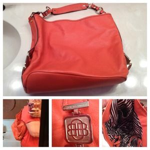 Orange Dana Buchman purse w/zebra stripe interior.
