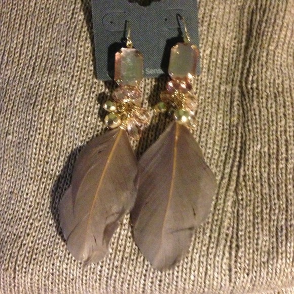 Feather earrings.