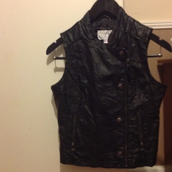 Sleeveless black jacket looks like leather but not