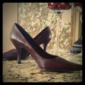 Brown medium heel pumps.
