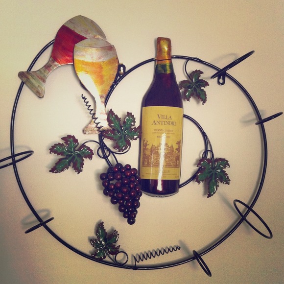 Wine rack, holds 3 bottles.