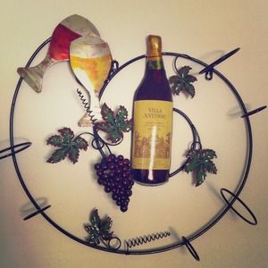 Wine rack, holds 3 bottles.