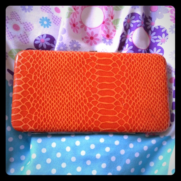 Cute orange clutch or wallet small and easy to fit